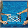 floating multi game board in the pool with 2 people playing a game