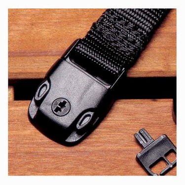 Black belt with buckle on a wooden surface