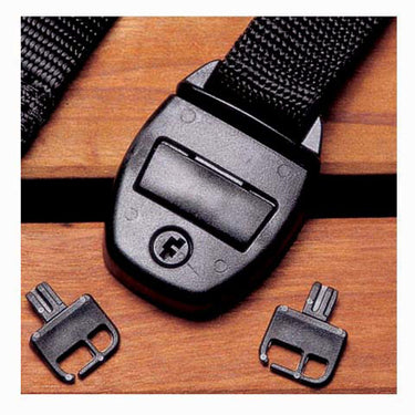 Black belt with a buckle and two separate buckles on a wooden surface