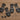 Black plastic clips and screws on a wooden surface