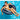 Boy floating on the inflatable monster tire ring