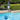 Easy Skim™ – Effortless Surface Cleaning for Pools & Spas. Pole not included - picture shows man using the easy skim in the pool.