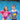 Lil' Splashers Swimming Pool Float Training Aid Swim Vest and Arm Floaties in one. Pink with seahorse for girls and blue with submarine for boys. Picture shown with a little girl and a little boy wearing them by the pool.
