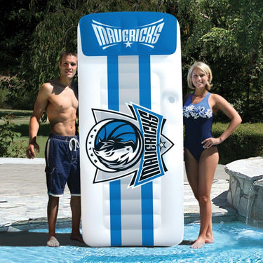 Dallas Mavericks NBA Giant Mattress - 9' 9" tall Shown with a man and a woman standing next to it for scale.