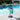 Towel rack with green towel by a poolside