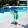 Towel rack with green towel by a poolside