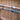 ABS Pole Hanger - set of 2 double blue hooks shown with a pole and net.