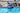 Child in water holding up the blue snake split ring float for size scale.