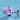 Big inflatable purple hippo with handles for kids to hang on. shown with boy riding it and mom standing by.