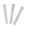 Three white plastic pins on a white background