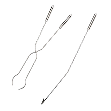 Set of metal tongs and poker on a white background