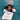 Doggy Paddle Kickboard white with black text. Little girl in water holding one