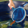 Blue life spa scoop with lady scooping a leaf from the water