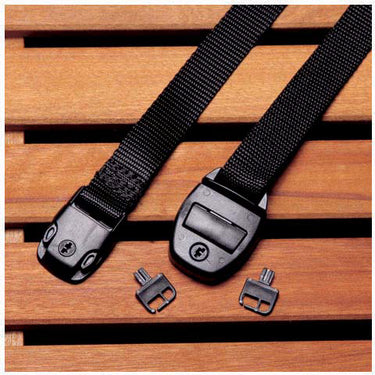 Black webbing strap with plastic buckle on a wooden surface