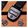 Black belt with a buckle and two separate buckles on a wooden surface