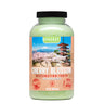 A clear bottle filled with light green bath salts in the scent "Cherry Blossom"