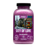 Purple container labeled 'City of Love' with a Parisian scene on a white background