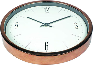16” Bronze Contemporary Clock with simplistic modern design. white face with black hands and numbers 12, 3' 6 & 9. showing bronze side of the clock.