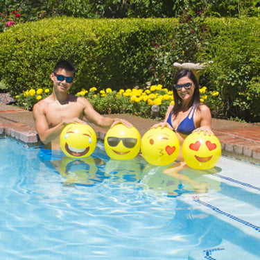 Four 16" Yellow inflatable balls with expressions of wink kiss, heart eyes & smile, hysterically laughing and cool guy with sunglasses and smile.