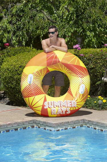 Yellow, Orange and White, large Tube with handles to hold on. Man standing next to it for scale.