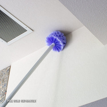 Cobweb Brush has large purple dome shaped brush that can attached to a pool  pole, for hard to reach corners in your home.  Easily brushes away cobwebs. Pictures show it attached to a pole (pole is not included) and reaching tall ceiling corners.