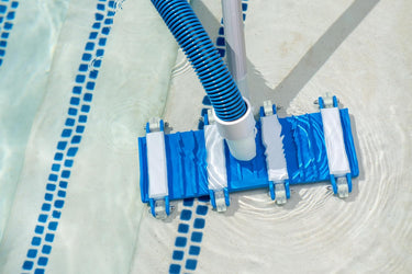 Blue and White Gunite Flexible Vacuum - Not for vinyl liner pools - showing vacuum vacuuming pool stairs