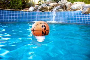 NBA Basketball Chlorine Dispenser floating in a swimming pool