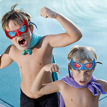Two boys, one wearing a red pair and a smaller boy wearing the red pair of Hero's Swim Goggles.