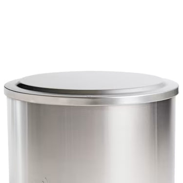 Stainless steel stove with a steel lid on a white background