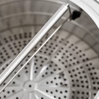 Close-up of an outdoor stove with a blurred background