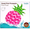 Box of a pink pineapple pool float with green leaves, brand 'Coconut' visible.