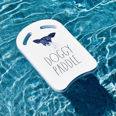 Doggy Paddle Kickboard white with black text. In water.