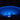 Blue illuminated pool at night with steps leading into it